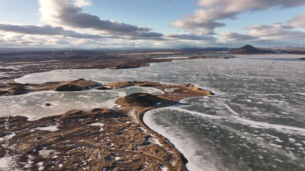 Frozen Lake Mývatn with volcanic pseudocraters near Skútustaðir in Reykjahlíð. Iceland