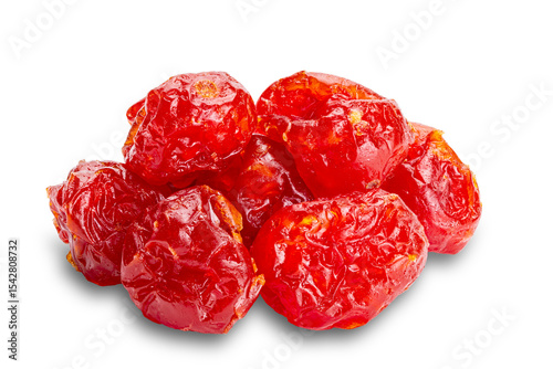 Pile of homemade dehydrated cherry tomatoes isolated on white background with clipping path.