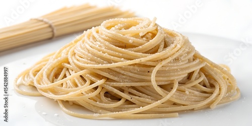 A nest of uncooked spaghetti on a white background.