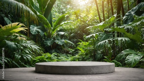 Gray concrete pedestal in a lush green jungle setting.