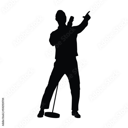 Silhouette of a Singer Performing on Stage with a Microphone