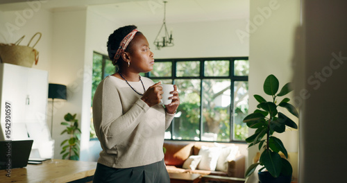 Fotografie Thinking, coffee and black woman in home for relax, peace or calm with serious mindset on weekend