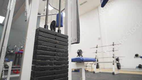 Lat pulldown machine stands with solid frame adjustable seat and precision-guided cable motion. Ideal for upper-body isolation exercises