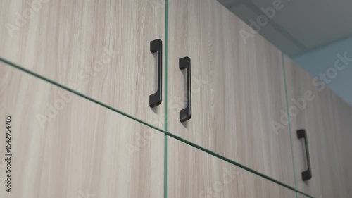 Wooden cabinet doors add warmth to minimalist student room. Natural textures enrich cozy functional atmosphere and clean aesthetic appeal
