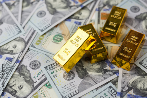 gold bars, dollars. Gold bar on US dollar banknotes, concept of economic investment, exchange