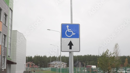 Visible parking sign marks space for individuals with limited mobility. Sign ensures accessibility fairness and organized traffic flow