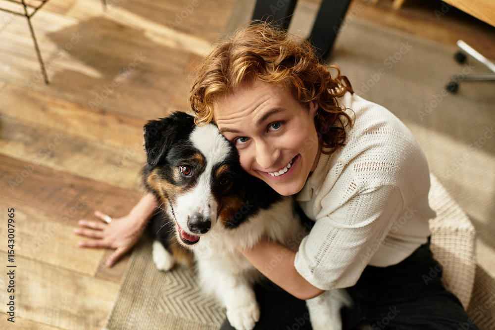 Young man enjoying cozy moments at home with his playful dog in a warm interior setting Young man enjoying cozy moments at home with his playful dog in a warm interior setting