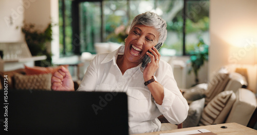 Mature woman, phone call and celebration with remote work from home, excited or success with deal. Person, smartphone and happy with PC for cheering, fist pump and goals for freelance career at house photo