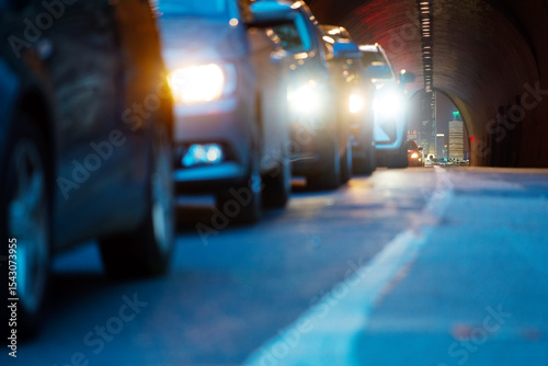 Car headlights in tunnel