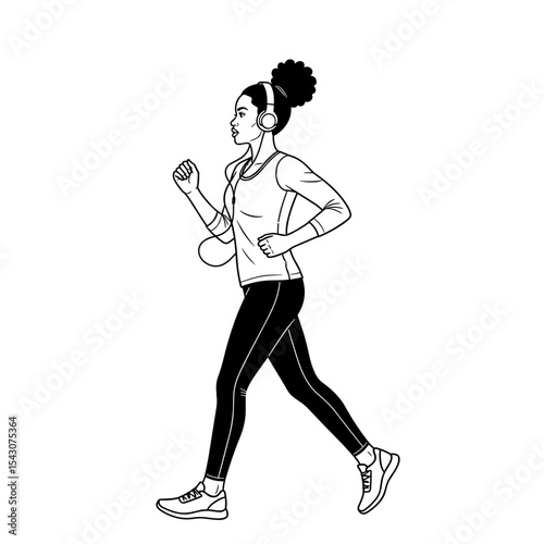 Woman walking briskly with headphones enjoying fitness routine in active lifestyle