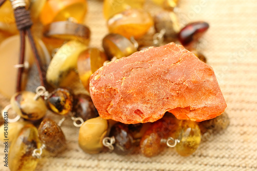 Amber decoration. Jewelry pendant . Sun stone. Fossil fossilized resin. semi-precious mineral. Natural material for jewelry. Copal. Fashion.  Natural pieces of amber stone. Amber crust. Beads