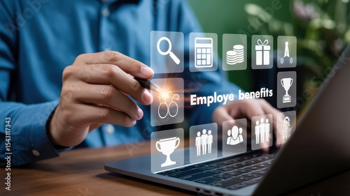 Person interacting with a digital display showing employee benefits.