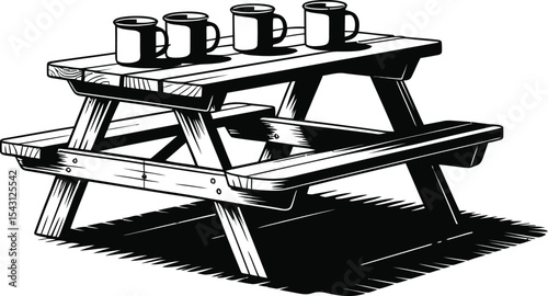 Picnic table with four enamel mugs