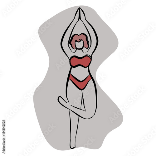 Young woman doing yoga exercise. Vrikshasana, tree pose