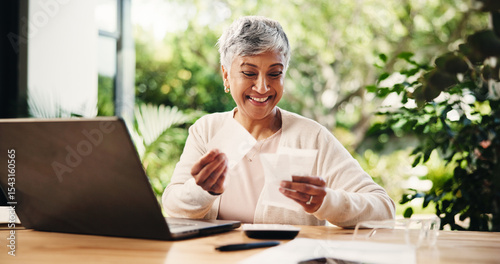 Senior, happy woman or laptop with receipts for tax return, deduction or finance at home. Mature, female person and smile with payslips or invoices for financial profit, banking or salary at house