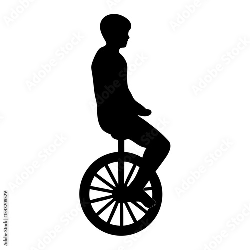 Silhouette of a boy riding a unicycle with a bare foot
