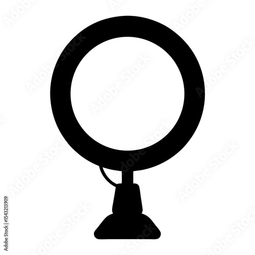 Black silhouette of an LED ring light on a stand for vlogging