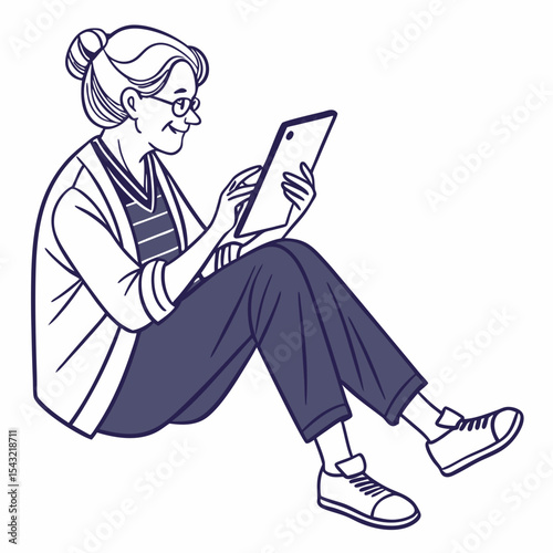 Senior woman sitting cross legged using tablet