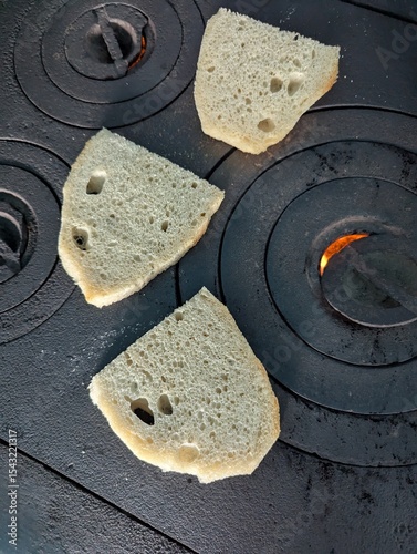 close up of a piece of bread on old traditional Romanian stove