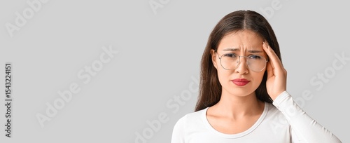 Young Asian woman suffering...