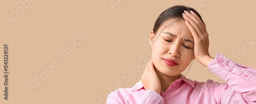 Young Asian woman suffering...