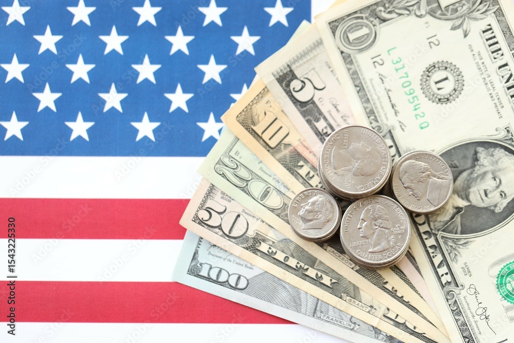 American US dollars money bills and on American flag close up American US dollars money bills and on American flag close up