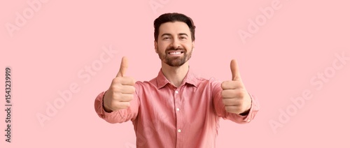 Happy man showing thumbs-up...