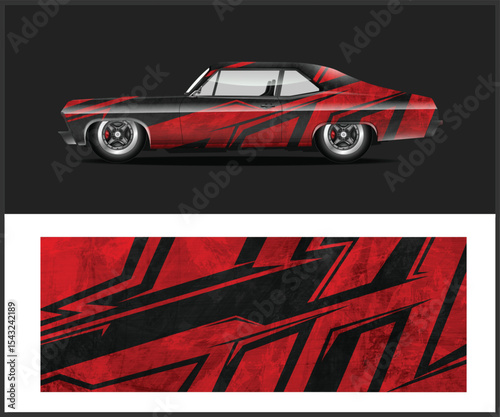 Sleek Sports Car with Custom Red and Gray Graphic Wrap on Display