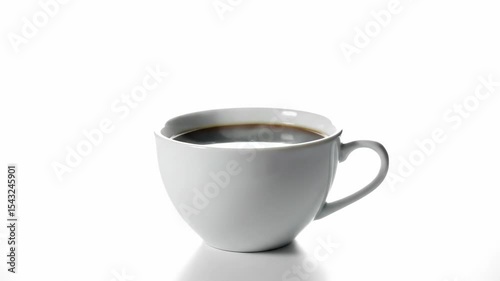 A white ceramic mug containing a dark beverage