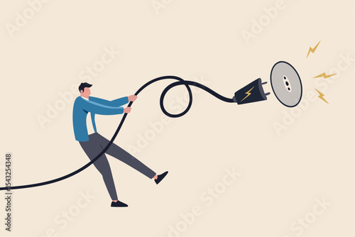 Electricity saving, ecology awareness or reduce electric cost and expense concept, man pulling electric cord to unplug to save money or for ecology power.