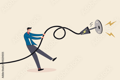 Electricity saving, ecology awareness or reduce electric cost and expense concept, man pulling electric cord to unplug to save money or for ecology power.