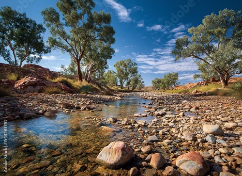A classic arid landscape with a rocky river bed and blue sky in the afternoon sun, this photograph captures the architecture of Australia's Outback in the northwest. 