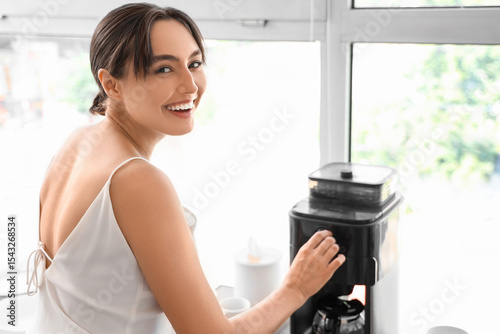 Beautiful young woman using...