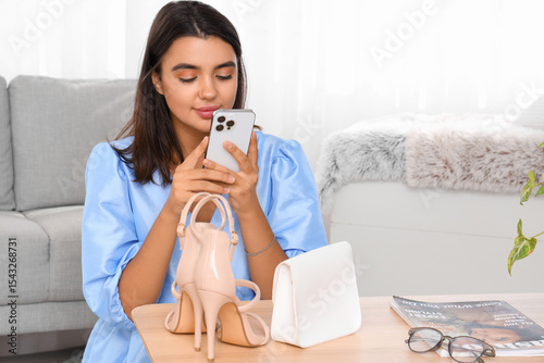 Young woman with mobile pho...