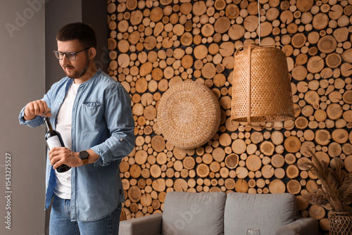 Sommelier opening bottle of...