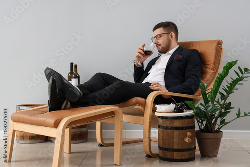 Young sommelier glass of wi...