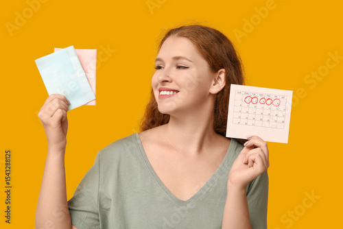 Young woman holding pads an...