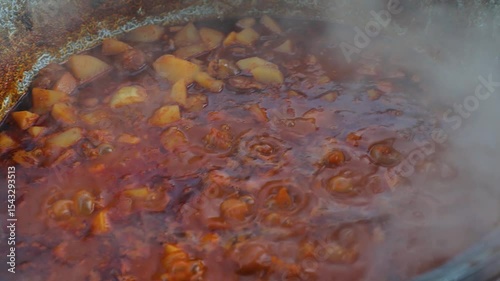Cooking on fire in iron pot