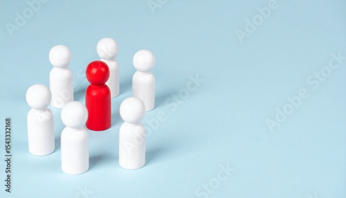 Red leader figure surrounded by white figures on a light blue background. The image symbolizes leadership, individuality, and standing out from the crowd.