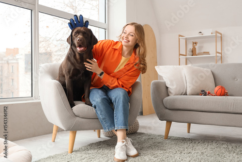 Young woman brushing her cu...
