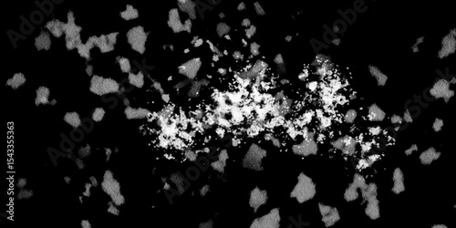Snowflakes on dark background. white icy snowflakes isolated on black background, natural background. white crystalline powder on a black background. sugar dust. texture, pattern and clipping.