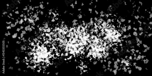 Snowflakes on dark background. white icy snowflakes isolated on black background, natural background. white crystalline powder on a black background. sugar dust. texture, pattern and clipping.