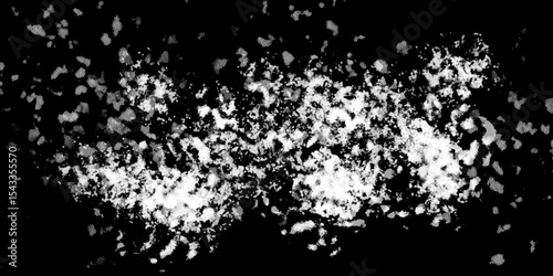Snowflakes on dark background. white icy snowflakes isolated on black background, natural background. white crystalline powder on a black background. sugar dust. texture, pattern and clipping.