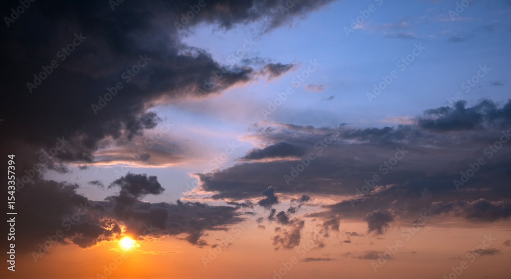 Fototapeta premium Sunset sky, big clouds