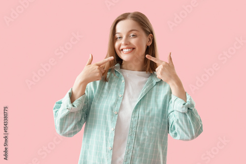 Young woman pointing at her...