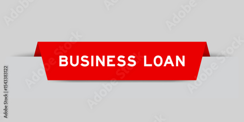 Red color inserted label with word business loan on gray background