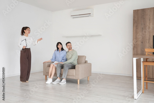 Female real estate agent sh...