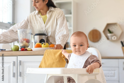 Cute little baby in high ch...