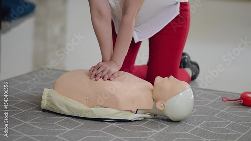 Hands-on CPR training in a modern facility with a mannequin in a practical session
