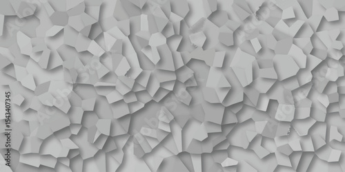 Abstract geometric pattern featuring overlapping polygon shapes in shades of gray with soft shadows and textural depth.